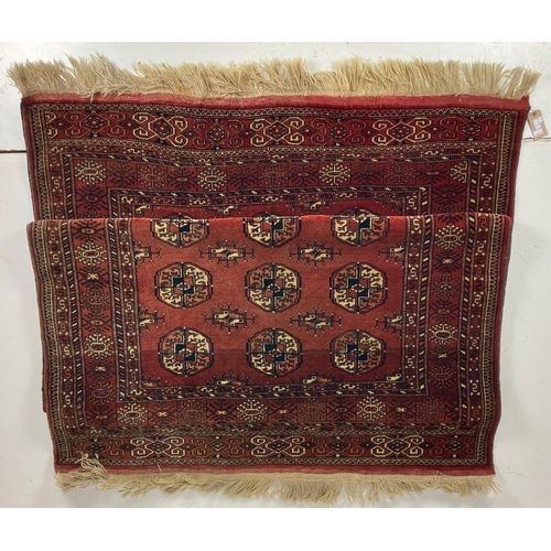 731 - A fine large Bokhara Rug, the burgundy ground with three rows of octagons inside a conforming border... 