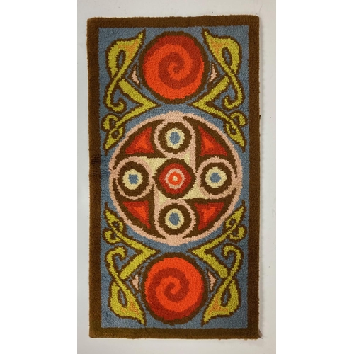 734 - A polychrome Celtic Revival wool Rug, with typical Celtic design, inside a brown border, 178cms x 94... 