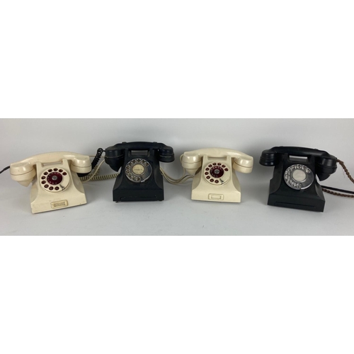 389 - Two Vintage black ring dial Bakelite Telephones, and two white similar ditto. (3)