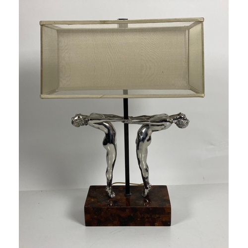 859 - An attractive Art Deco Table Lamp, modelled with two silvered nude figures holding hands, 71cms (28