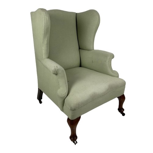 1058 - A Georgian style wing back Armchair, covered in lime fabric on front cabriole legs. (1)... 