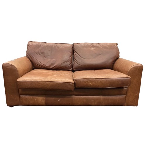 1062 - A leather two seater Sofa. (1)