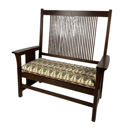 1098 - A good oak Stickley Settee, the high back with twenty-nine vertical rails above a padded seat with s... 