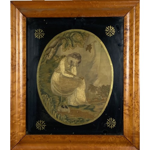 1109 - An early 19th Century oval silk Needlework Picture, depicting a seated Woman and Dog, 30cms x 24cms ... 