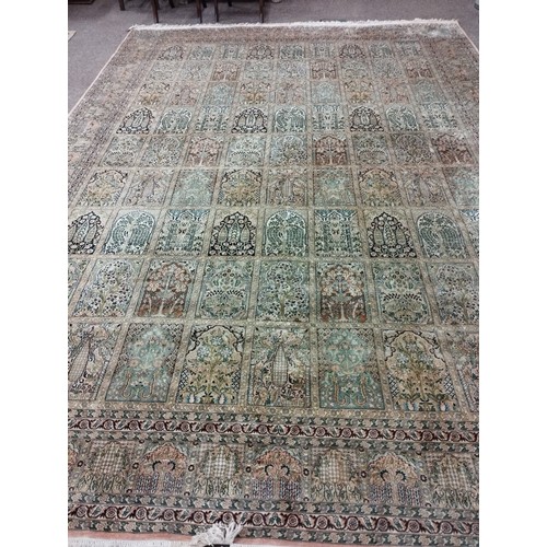 1114 - A magnificent pair of 20th Century silk Middle Eastern Carpets, the cream and rust ground with multi... 