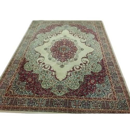 1112 - A fine quality Axminister cream ground Middle Eastern style machine turned woollen Carpet, the large... 