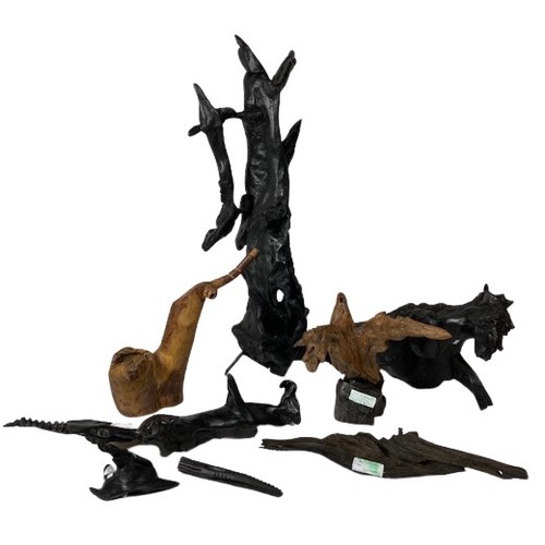 491 - Ahmed EssadA collection of fine and unusual carved and free form Irish Bog Oak Art Pieces, including... 