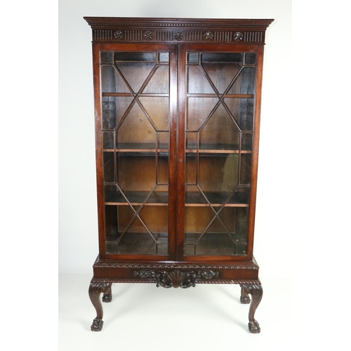 23 - A mahogany Display Cabinet, in the Chippendale style, 20th Century, the dentil moulded cornice above... 
