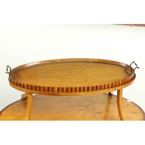 46 - A two tier Edwardian satinwood inlaid and crossbanded Supper Table, with oval shelves, the top with ... 