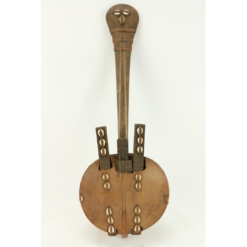 75 - A 19th Century West African Kora, with hide covering and shell decoration. (1)