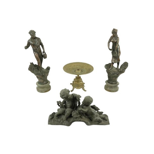 93 - A pair of Spelter Figures, 'L'Agriculture' 18'' (46cms), together with a brass Table Centre, on... 