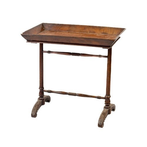 86 - A fine quality Irish mahogany William IV tray top Table, united by turned stretchers, on carved leaf... 