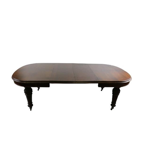 125 - A fine quality Irish Victorian mahogany extending Dining Table, with two spare leaves, the moulded e... 