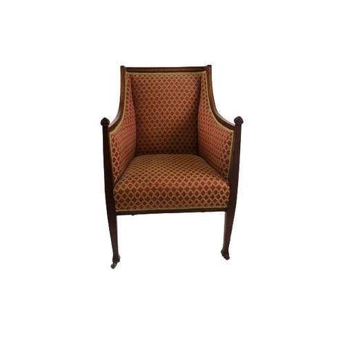 130 - An Edwardian inlaid upholstered Armchair, with shaped sides, covered in red ground and trestle type ... 