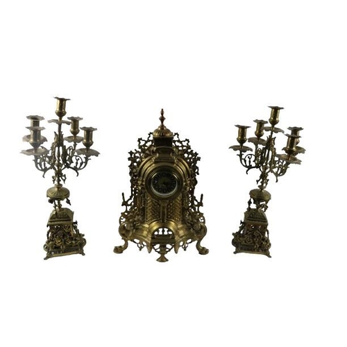36 - A French style brass Clock Garniture, the dome pierced decorated Clock with circular dial and Roman ... 