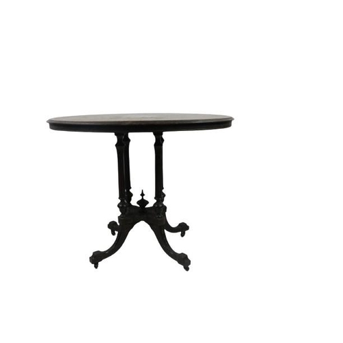 96 - An Aesthetic period ebonised and inlaid oval Loo Table, with reeded pillar supports on a quatreform ... 