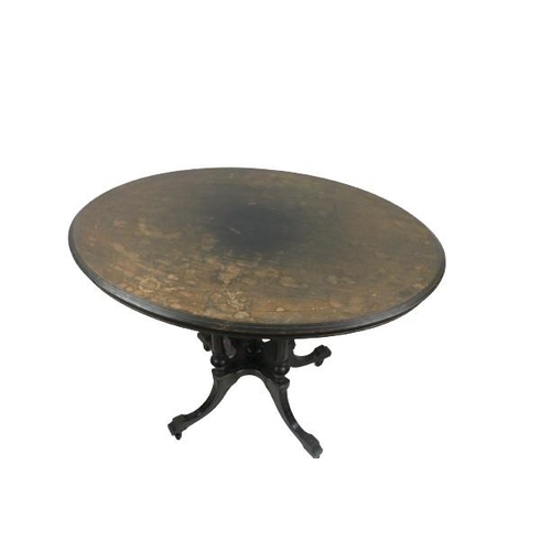 96 - An Aesthetic period ebonised and inlaid oval Loo Table, with reeded pillar supports on a quatreform ... 