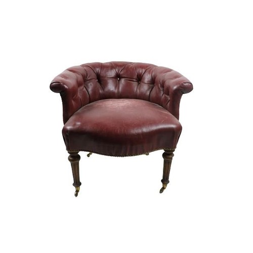 98 - An Edwardian Tub Armchair, covered in deep button red leather on front reeded legs with bass castors... 