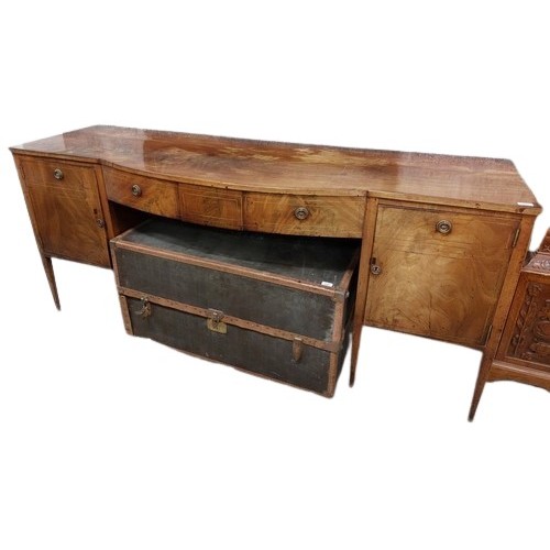 34 - An inlaid and bow fronted mahogany Sideboard, 19th Century with centre mock frieze drawer, flanked e... 