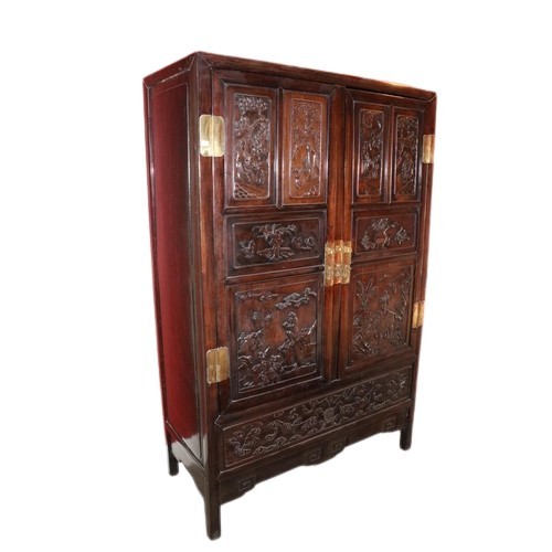 41 - A carved hardwood Cabinet (GUI) Qing Dynasty, of rectangular outline with a pair of hinged doors sep... 