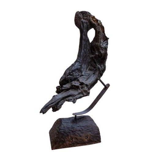 31 - 'An Bradán - The Salmon,' a natural bog oak design, mounted on a metal stand with wooden base, appro... 