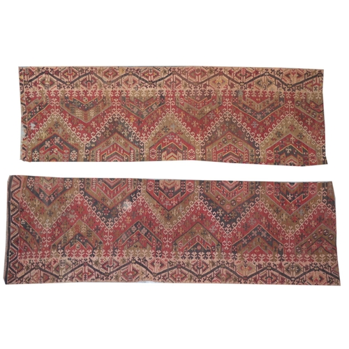 427 - An Oriental Kilim Rug, with a row of hexagonal medallions on an iron red ground inside a conforming ... 