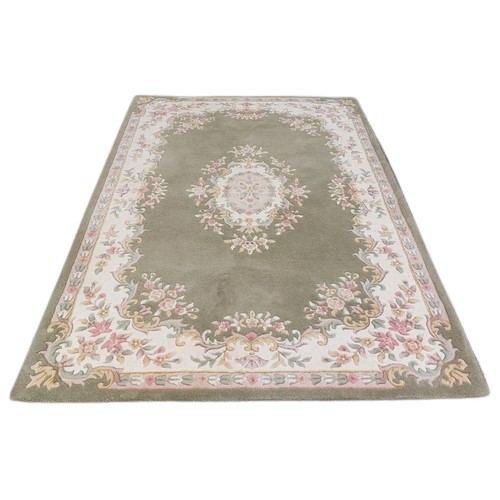 417 - An attractive Tolech design Inolius woollen Carpet, the green ground with central floral motif and s... 