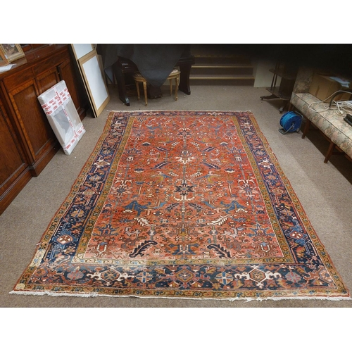 413 - A fine quality semi-antique heavy woollen Carpet, the central panel on burgundy ground with floral a... 