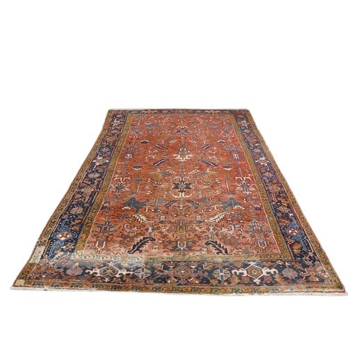 413 - A fine quality semi-antique heavy woollen Carpet, the central panel on burgundy ground with floral a... 