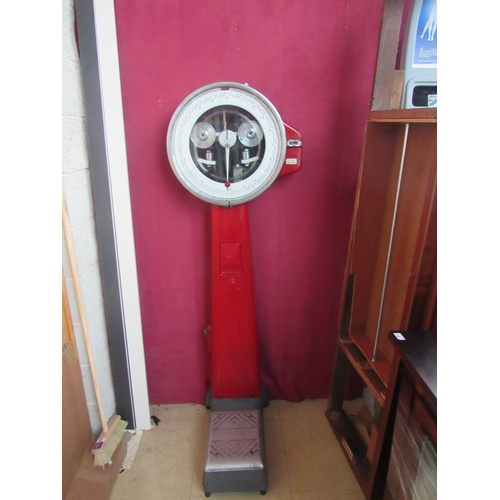 411 - A Berkel Coin operated tall Weighing Scales, painted red, approx. 175cms (69