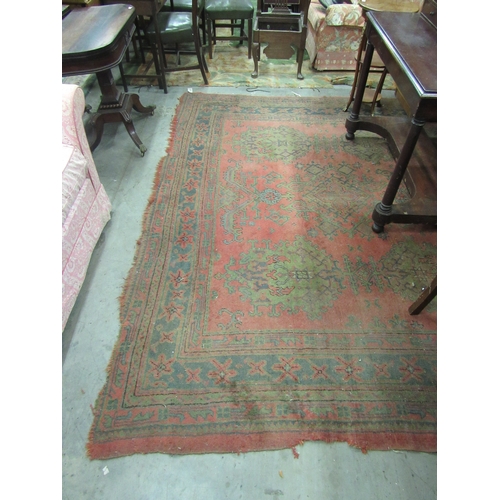 421 - A 19th Century red ground Carpet, with multiple decorated border and centre, approx. 348cms x 282cms... 