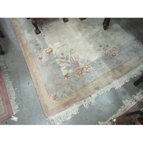 423 - A large Chinese woollen cream ground Carpet, with floral decorated border, approx. 360cms long x 282... 