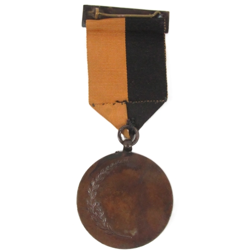 699 - A War of Independence Medal (1917-22), with Celtic design suspension bar, black and amber ribbon, th... 