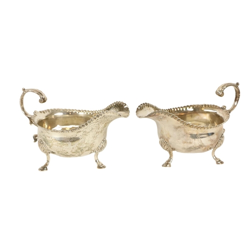 113 - A pair of English George III antique silver Sauceboats, London 1759, by William Skeen, each with bea... 