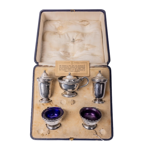 14 - A cased English silver Condiment Set, comprising salt and pepper shakers, mustard pot, and pair of b... 
