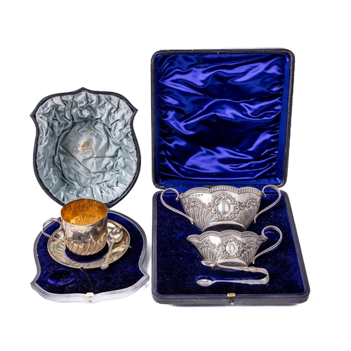16 - A cased English silver Christening Cup and Saucer, and Spoon, by E.H. (Wm. Hutton & Sons) retail... 