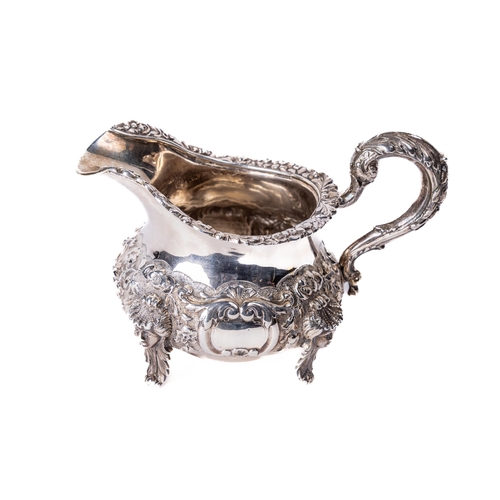 33 - An Irish Victorian period silver Cream Jug, by James Le Bas, c. 1843, the body with floral edge and ... 