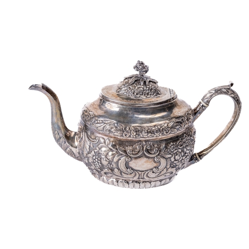 35 - An attractive Irish Georgian period oval shaped silver Teapot, by Robert Breading, Dublin 1804, the ... 