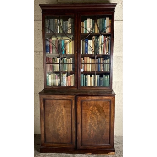 554 - A George III period mahogany Bookcase, the moulded cornice above two astragal glazed doors on a base... 