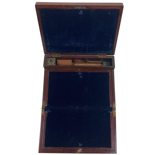 1093 - An early 19th Century mahogany Lap Desk, with concealed brass handles and fold out writing compartme... 