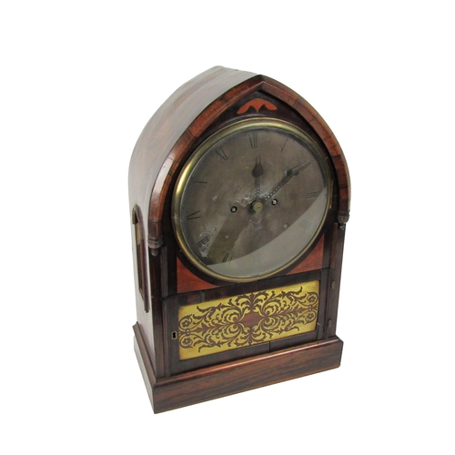 1055 - An unusual rosewood cased Regency period arched top Bracket Clock, with circular silvered dial, sign... 