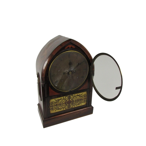 1055 - An unusual rosewood cased Regency period arched top Bracket Clock, with circular silvered dial, sign... 