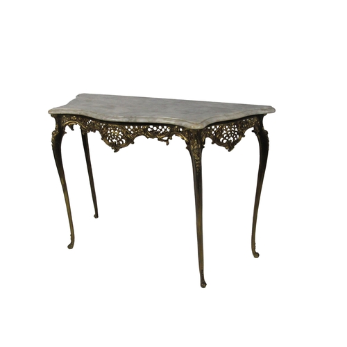 1087 - A French Louis XVI style Console Table, the moulded white marble serpentine top over a rococo decora... 