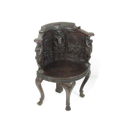 1109 - A 19th Century Cromwellian style carved oak Corner Chair, the panelled back with central figure, fla... 