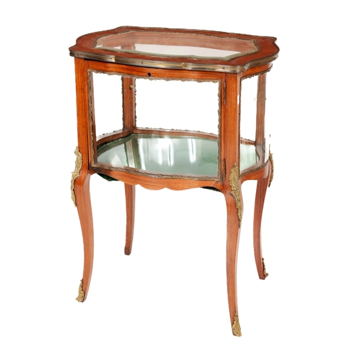 1125 - A fine quality French style kingwood Display Cabinet, the shaped top with panelled glass, ormolu fra... 