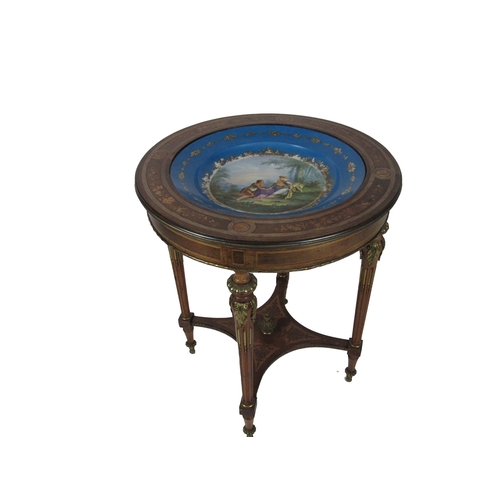 1130 - An attractive French Louis XVI style circular Table, the top inset with Sevres type decorated bowl w... 