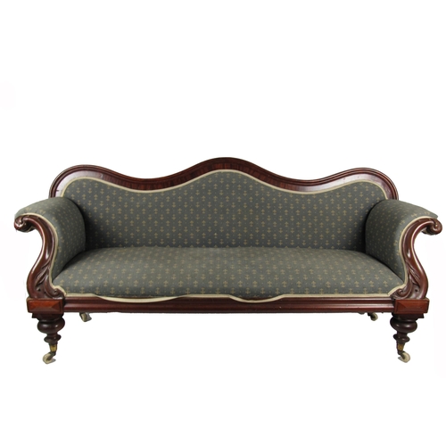 1138 - A Victorian mahogany framed Settee, in the manner of Strahan, the shaped back issuing padded seat an... 