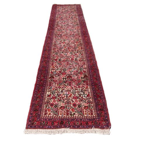 1186 - An attractive Middle Eastern heavy woolen Carpet Runner, (Persian - Rudbah) the central cream ground... 