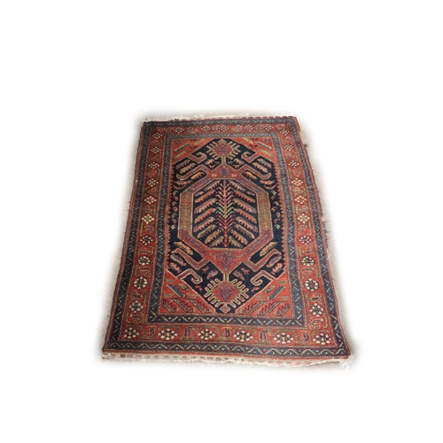 1190 - An attractive antique woolen oblong Carpet, the central navy ground with floral medallion, the burgu... 