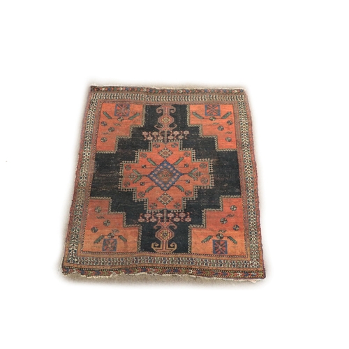 1191 - A small antique Middle Eastern Rug, the central navy ground panel with large floral geometric m... 